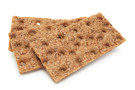Whole grain rye crispbread isolated on white