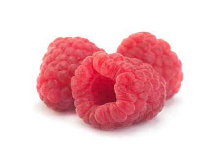 Raspberry fruit closeup isolated on white background