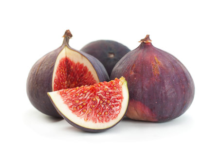 Purple fig fruit closeup isolated on white backgroundの写真素材