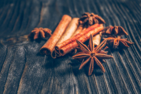 Spices and herbs. Food and cuisine ingredients. Cinnamon sticks, anise stars,  Cloves on textured backgroundの写真素材