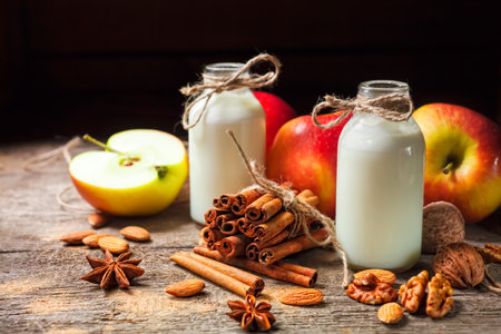 Healthy eating for weight loss: smoothie from red apples, banana, almonds and cinnamon, selective focusの写真素材