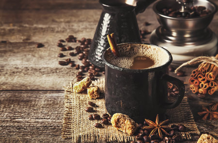 Old coffee cup and mill on dark rustic backgroundの写真素材