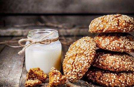 Drinking yogurt in bottles and cookies, selective focusの写真素材