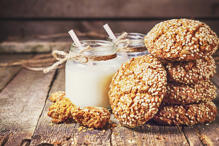 Drinking yogurt in bottles and cookies, selective focusの写真素材