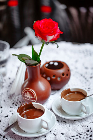 Cup of tasty hot chocolate on wooden background, closeup hot chocolate in white mug (shallow depth of field)の写真素材