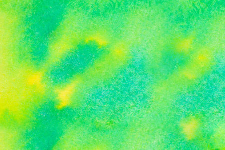Green and yellow watercolor background on embossed paper with blue dots . Abstract watercolor pattern.の写真素材