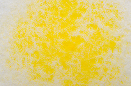 Yellowwatercolor stain on embossed paper on white background. Abstract watercolor patternの写真素材