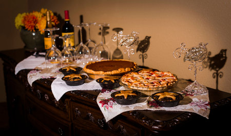 A beautiful arrangement of Thanksgiving Holiday Pies including pumpkin, cherry and minced meat.の写真素材