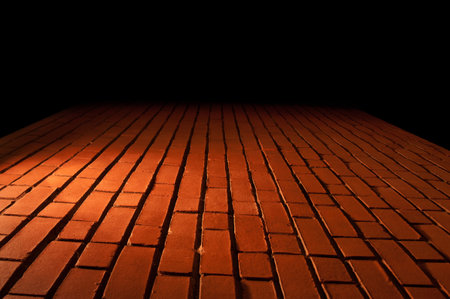 Red Brick Wall Texture with a light from top downwardの写真素材