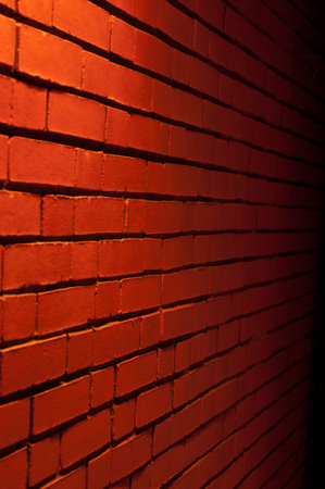 Red Brick Wall Texture with a light from top downwardの写真素材