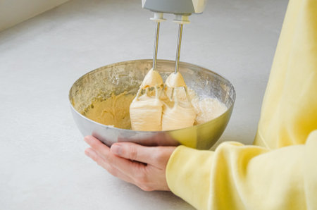 Mixing Pie Dough in Metal Bowl on Bright Kitchen Counter