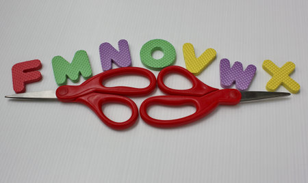 rubber alphabets and scissorsの写真素材