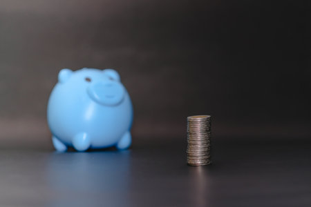 There is money coins to stack of coins. Close up of coins to stack of coins and piggy bank,Money, Financial, Business Growth conceptの写真素材