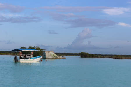 Boat on the beautiful lagoon of seven color - Bacalarの写真素材