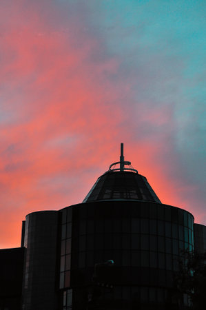 Sunrise over modern office buildings in business district center of Odesa. Skyline view of cityscape with sunlight and flare in warm light color tone. Construction business concept. High quality photoの写真素材
