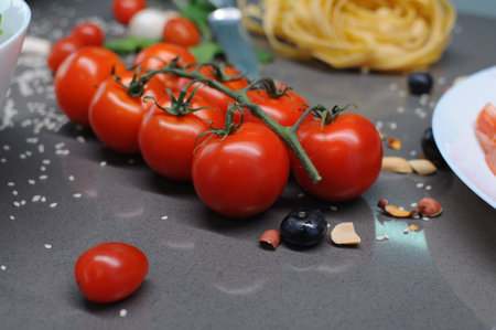 Fresh tomatoes in a plate on a dark background. Harvesting tomatoes. Top view. High quality photoの写真素材