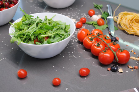 Fresh tomatoes in a plate on a dark background. Harvesting tomatoes. Top view. High quality photoの写真素材