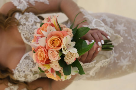 Bright Beautiful bridal bouquet with roses and ribbon. High quality photoの写真素材