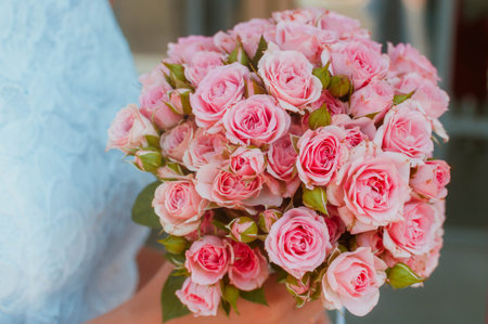Bright Beautiful bridal bouquet with roses and ribbon. High quality photoの写真素材