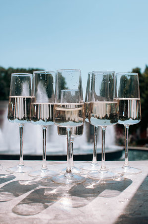 A lot of glasses of champagne in a luxurious atmosphere. Stylish, toned photo.の写真素材