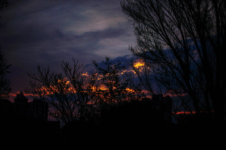 Sunrise over modern office buildings in business district center of Odesa. Skyline view of cityscape with sunlight and flare in warm light color tone. Construction business concept. High quality photoの写真素材