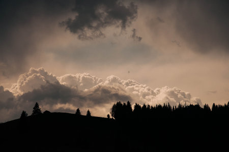 Horizontal shot of a mountain sunrise with a black foreground and copy space. High quality photoの写真素材