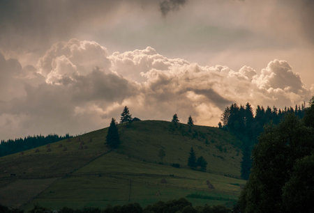 Horizontal shot of a brilliant mountain sunrise with a black foreground and copy space. High quality photoの写真素材
