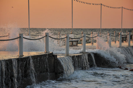 Sunset at the beach. Cloudy sunset and pier. High quality photoの写真素材