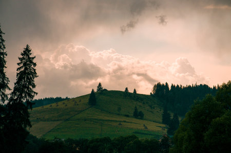Horizontal shot of a brilliant mountain sunrise with a black foreground and copy space. High quality photoの写真素材