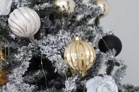 Close-up of Christmas presents in wrapping paper are on the floor under the Christmas treeの写真素材