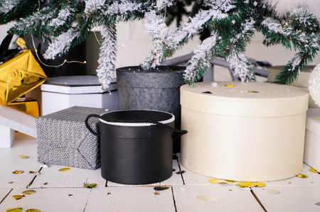 Close-up of Christmas presents in wrapping paper are on the floor under the Christmas treeの写真素材