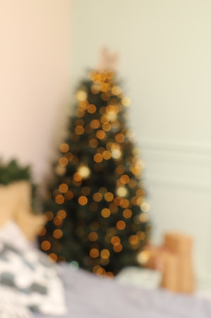 A Christmas tree with a lot of lights and a lot of snow.の写真素材