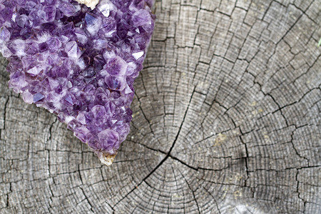 Slice of Amethyst Geode on an old Tree Stumpの写真素材