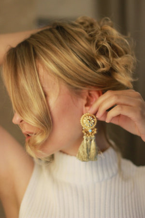 Defocused portrait of blond beautiful woman. close-up. golden light. curly hair