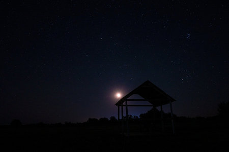 Night sky with lot of shiny stars, natural astro background with the glowing moon.の写真素材