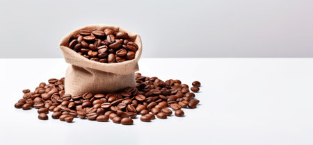 Bag of fresh roasted coffee beans isolated on white background. Banner.の素材