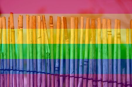 A fence made of twigs in the garden. LGBT natural pattern, Vintage texture background, Abstract paintingの写真素材