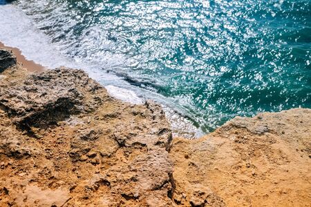 Rock by the sea. The concept of harmony, energy of life and meditation. Benagil Beach in Portugal