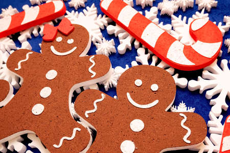 a lot of white foam snowflakes, candy lollipop, gingerbread people Christmas decor for home, office, shopの写真素材