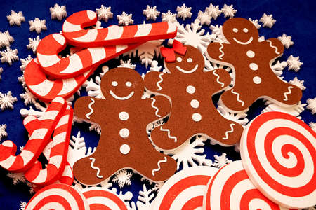 a lot of white foam snowflakes, candy lollipop, gingerbread people Christmas decor for home, office, shopの写真素材