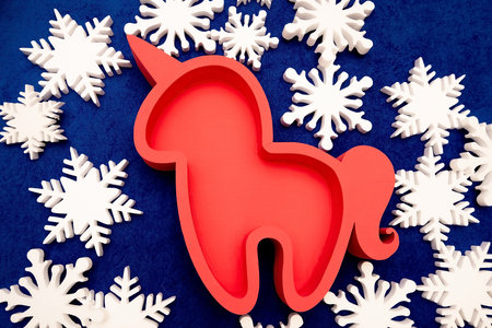 foam boxes made of pepoplast, extruded polystyrene foam for edible bouquets. pink unicorn. gift wrapping on a background of snowflakesの写真素材