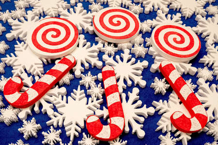 a lot of white foam snowflakes, candy lollipop, Christmas decor for home, office, shopの写真素材