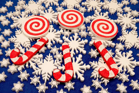 a lot of white foam snowflakes, candy lollipop, Christmas decor for home, office, shopの写真素材