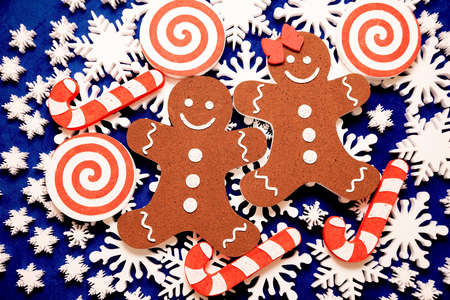 a lot of white foam snowflakes, candy lollipop, gingerbread people Christmas decor for home, office,...
