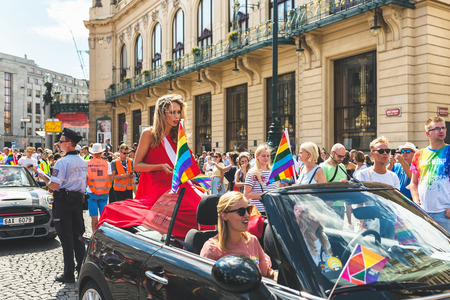 Prague, Czech Republic - August 11, 2018: Transgender model Loiza Lamers on a car at the annual Prague Gay Pride parade on the Republic Square. Crowd with rainbows flags and signs.のeditorial素材