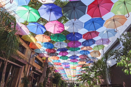 Colorful umbrellas street decoration on shopping alley in Nicosia, Northern Cyprus. Sunny day.の写真素材