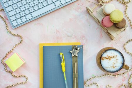 Notepad, pen, keyboard and coffee. Christmas workspaceの写真素材