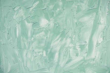 Abstract light green and white rough concrete wall or stucco texture background