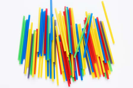 Many colorful plastic straws on white background. Recycle, environment conversation, pollution and plastic straw ban concept. Copy spaceの写真素材