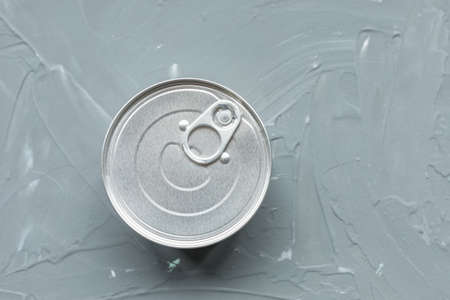 One tin canned food, no label on gray background. Provisions or cat food concept. Close up, top view, copy spaceの写真素材